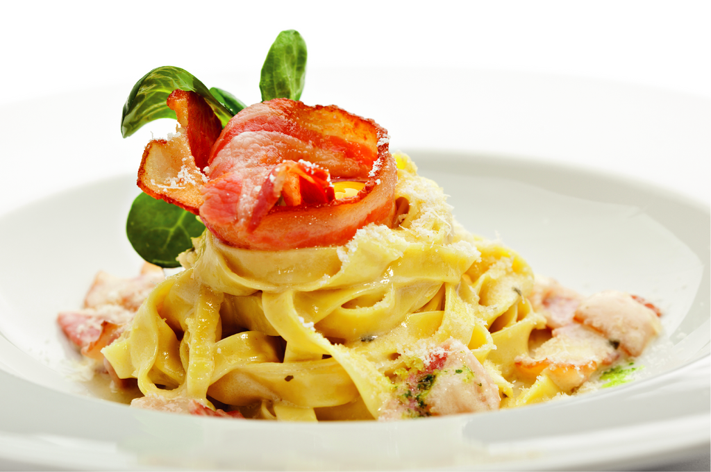 Tagliatelle all'uovo con funghi porcini e pancetta